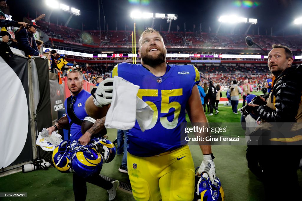 Id Center Rasm Los Angeles Rams center Brian Allen looks to give a fan his towel ...