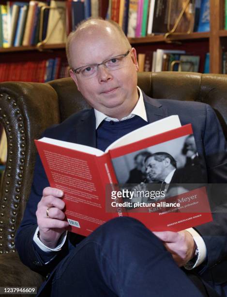 January 2022, Schleswig-Holstein, Flensburg: Stefan Seidler , the only member of the Bundestag of the Südschleswigsche Wählerverband, reads a book in...