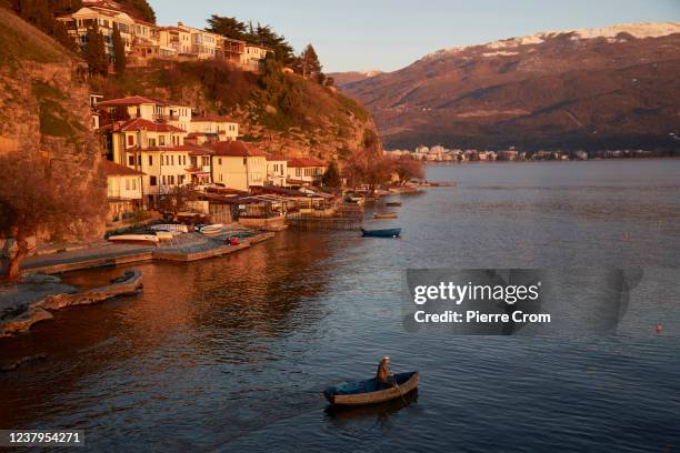 Local fisherman works on a boat on Lake Ohrid on January 15, 2022 in Ohrid, North Macedonia. The new governments of latest NATO member North...