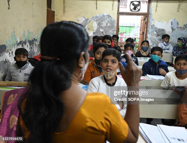 Teacher seen teaching students at Gandhi Memorial English High School in Mumbai. Maharashtra state government has decided to reopen pre-primary...