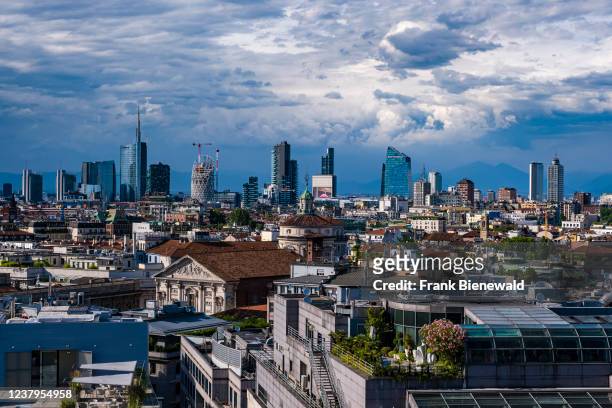 View over the rooftops of Milan to one of the most important business districts of Milan, the suburb of Porta Nuova with its modern architecture.