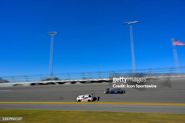 The PR1 Mathiasen Motorsports ORECA LMP2 07 in the LMP2 class driven by Jonathan Bomarito and Josh Pierson races along the turn 4 banking during the...