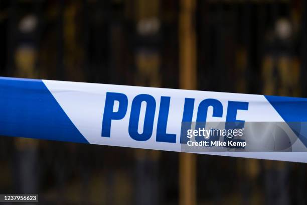 Close up of police tape as used by the Metropolitan police force on 22nd January 2022 in London, United Kingdom. Police tape acts as a minor...