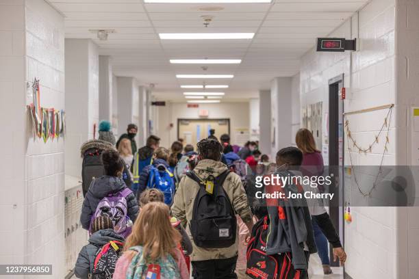 Children move about in a hallway at Carter Traditional Elementary School on January 24, 2022 in Louisville, Kentucky. Students in the district are...