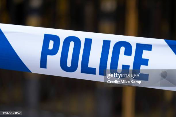 Close up of police tape as used by the Metropolitan police force on 22nd January 2022 in London, United Kingdom. Police tape acts as a minor...