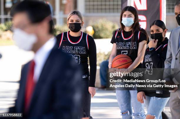 Van Nuys, CA Arleta high basketball players, L to R, Destiny Salcedo, Maribel Rodriguez, and Erika Cajero listen as California State Senator Dr....