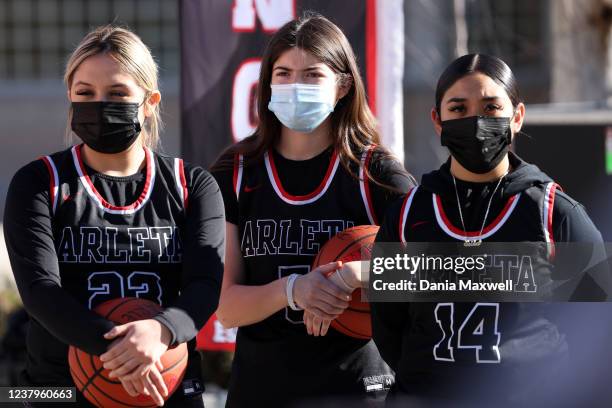 High school students Destiny Salcado, Maribel Rodriguez and Erika Cajero, left to right, stand during a press conference to announce a bill that adds...