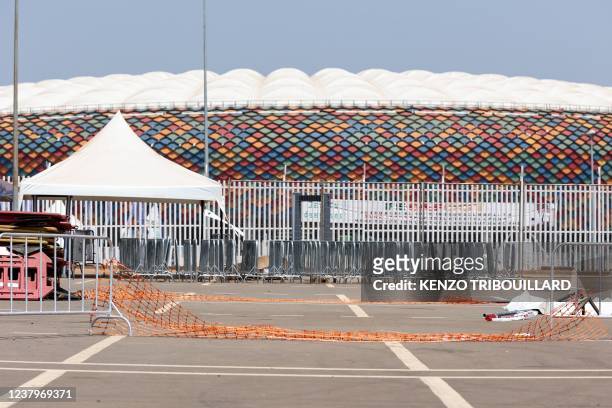 This picture taken on January 25, 2022 at the entrance of Olembe stadium in Yaounde shows barriers on the ground at the scene of the stampede. -...