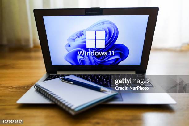 Windows 11 operating system logo is displayed on a laptop screen for illustration photo. Gliwice, Poland on January 23, 2022.