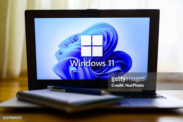 Windows 11 operating system logo is displayed on a laptop screen for illustration photo. Gliwice, Poland on January 23, 2022.