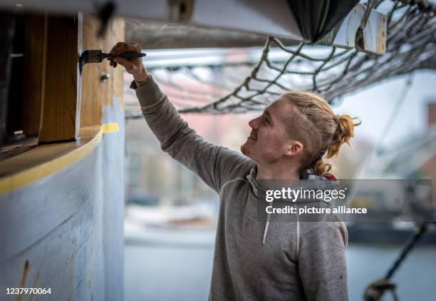 January 2022, Mecklenburg-Western Pomerania, Greifswald: Boatbuilder Florian Woll, current national winner in the German Craftsmen's Performance...