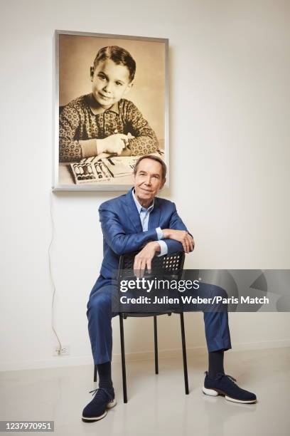 Artist Jeff Koons is photographed for Paris Match with a portrait work of himself titled "The New Jeff Koons" on show at the Al Riwak gallery on...