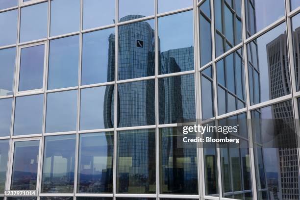 The headquarters of Deutsche Bank AG reflected in the windows of an office building in Frankfurt, Germany, on Monday, Jan. 24, 2022. Deutsche Bank...