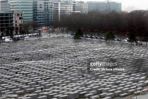 January 2022, Berlin: View over the field of stelae of the Memorial to the Murdered Jews of Europe, also called the Holocaust Memorial. January 27 is...