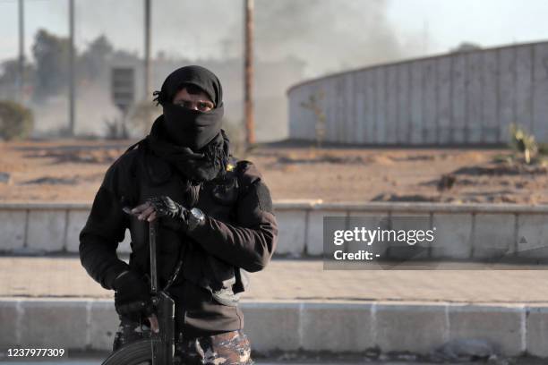 Members of the Syrian Democratic Forces deploy around Ghwayran prison in Syria's northeastern city of Hasakeh on January 25 which was taken over by...