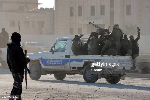 Members of the Syrian Democratic Forces deploy around Ghwayran prison in Syria's northeastern city of Hasakeh on January 25 which was taken over by...