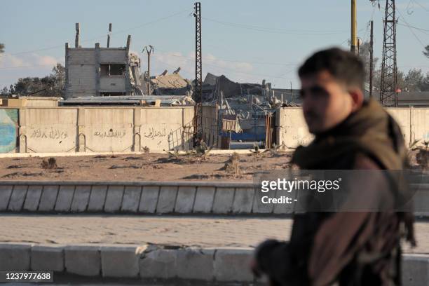 Members of the Syrian Democratic Forces deploy around Ghwayran prison in Syria's northeastern city of Hasakeh on January 25 which was taken over by...