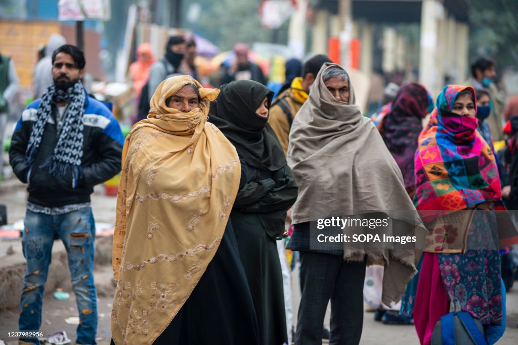 Muslim woman seen walking while shivering during the cold...