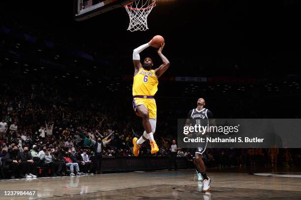 LeBron James of the Los Angeles Lakers dunks the ball during the game against the Brooklyn Nets on January 25, 2022 at Barclays Center in Brooklyn,...