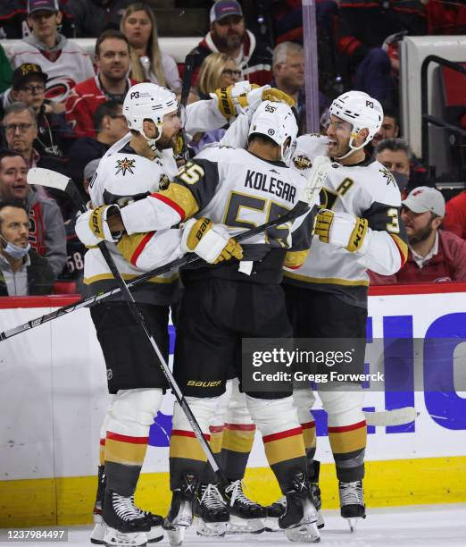 Nolan Patrick of the Vegas Golden Knights celebrates with teammates after scoring a goal during an NHL game against the Carolina Hurricanes on...