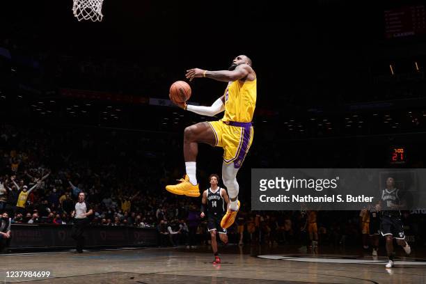 LeBron James of the Los Angeles Lakers dunks the ball during the game against the Brooklyn Nets on January 25, 2022 at Barclays Center in Brooklyn,...