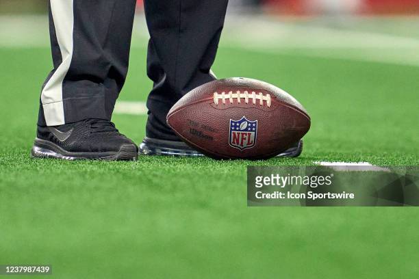 Detail view of the NFL logo crest is seen on a Wilson game ball resting on the field during the NFC Wild Card game between the San Francisco 49ers...