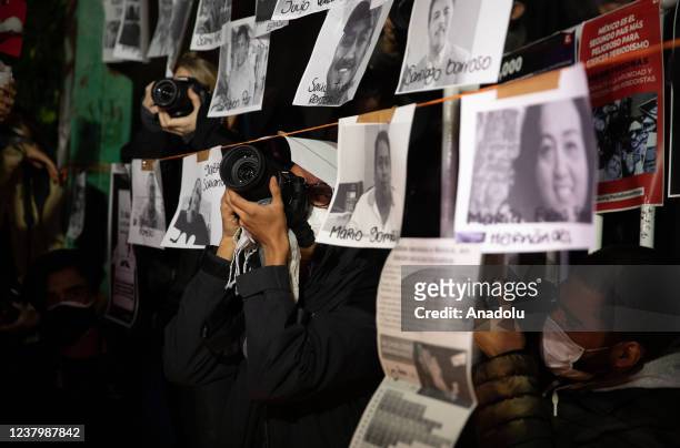 Photojournalists take photos during a protest to demand justice for murders of colleagues, in front of the Interior Ministry Office, in Mexico City,...