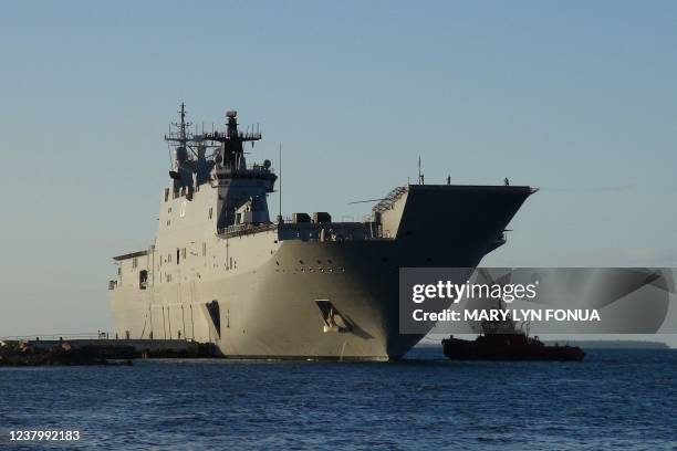 This photo shows the Australian Navy's HMAS Adelaide docked at Vuna Wharf in Tonga's capital Nukualofa on January 26 to deliver aid following the...