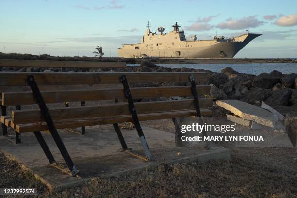 This photo shows the Australian Navy's HMAS Adelaide docked at Vuna Wharf in Tonga's capital Nukualofa on January 26 to deliver aid following the...