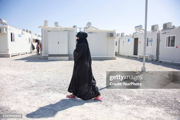 Young woman as seen walking in the camp wearing the traditional muslim abaya. Inside the new Refugee camp in Samos island that has been created in...