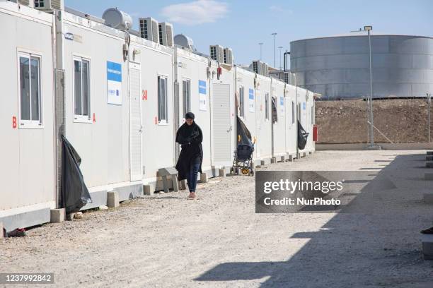 Young woman as seen walking in the camp wearing the traditional muslim abaya. Inside the new Refugee camp in Samos island that has been created in...