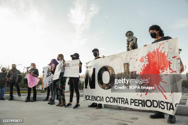 Protesters hold a banner during a demonstration against the murder of the three journalists Jose Luis Arenas, Margarito Martinez and Lourdes...