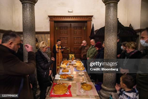 Worshipers attend a St. John day ceremony at an orthodox church in Banja Luka, Bosnia and Herzegovina, on Wednesday, Jan. 19, 2022. As the world...