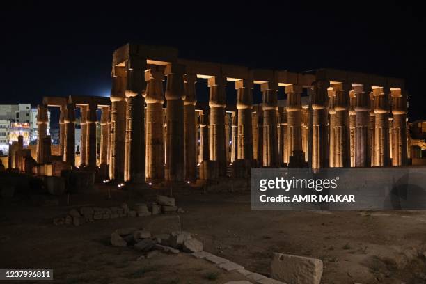 This picture taken on January 18, 2022 shows a view of the lit-up Luxor Temple at night in Egypt's southern city of Luxor.