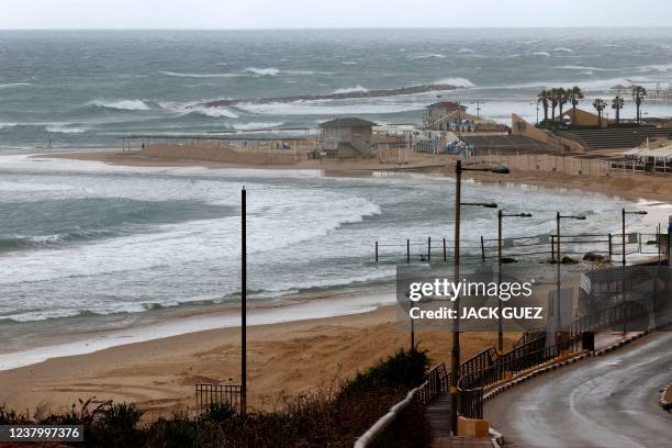 Waves crash on the seashore in the Israeli coastal city of Netanya during stormy weather, on January 26, 2002.