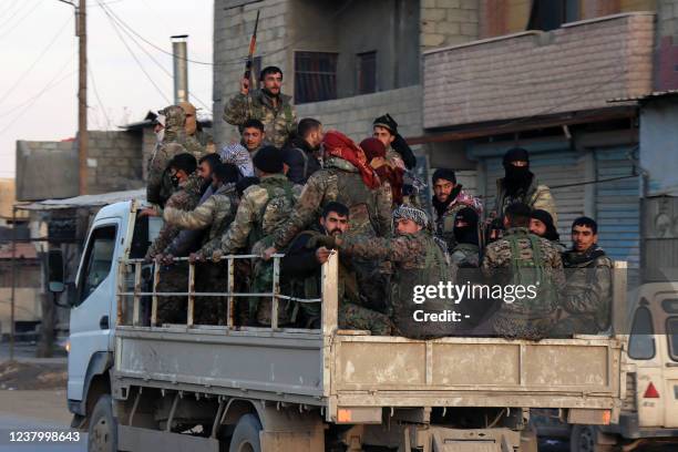 Members of the Syrian Democratic Forces deploy outside Ghwayran prison in Syria's northeastern city of Hasakeh on January 26 after having declared...