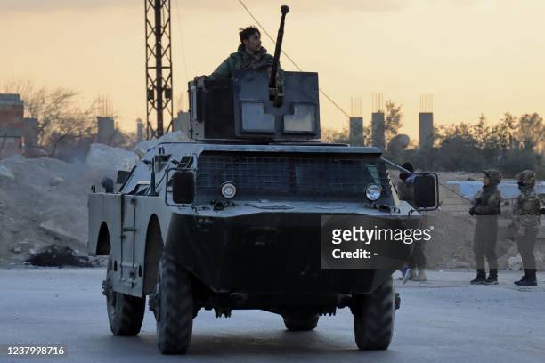 Members of the Syrian Democratic Forces deploy outside Ghwayran prison in Syria's northeastern city of Hasakeh on January 26 after having declared...