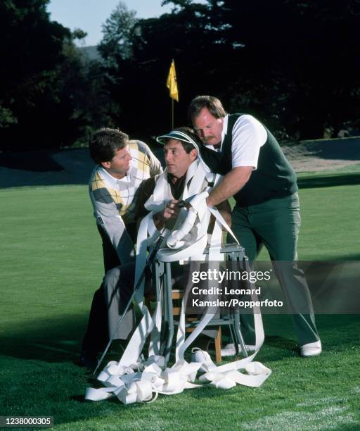 Left to right, Lanny Wadkins Fuzzy Zoeller , and Craig Stadler, enacting a "slow play" scenario with Zoeller being tied to a chair, circa 1986.