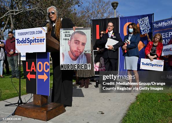 Orange County District Attorney Todd Spitzer listens as Emma Rivas ...