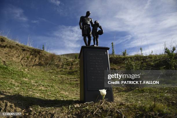 Bronze sculpture by artist Dan Medina, depicting Kobe Bryant, daughter Gianna Bryant, and the names of those who died, is displayed as a one-day...