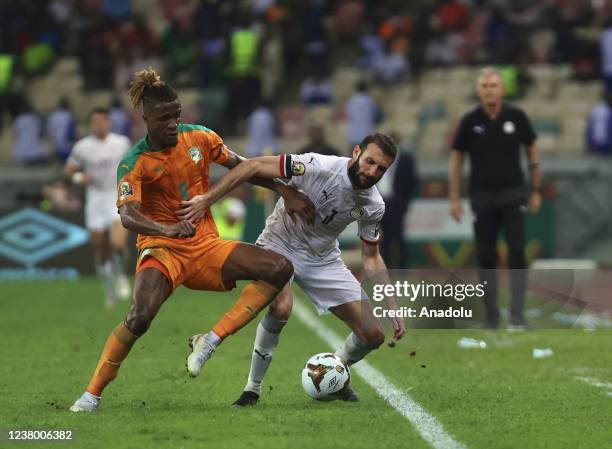 Omar Kamal Sayed Abdel Wahed of Egypt in action against Wilfried Zaha of Ivory Coast during the Africa Cup of Nations 2021 round of 16 football match...