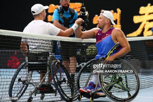 Netherlands' Sam Schroder shakes hands with Australia's Dylan Alcott after their men's quad wheelchair singles final match on day eleven of the...