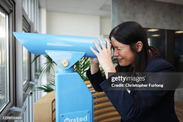 Lisa Nandy, Shadow Secretary of State for Levelling Up, Housing, Communities & Local Government looks through a telescope to see a wind farm at the...