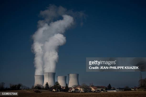 Photograph shows vapor rising from cooling towers of the Bugey nuclear power plant on January 25 in Saint-Vulbas, central eastern France. - Operating...