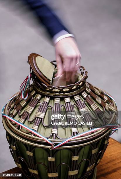 Member of parliament casts his vote during a fourth round of voting for Italy's new president on January 27, 2022 in Rome's parliament. - The fourth...