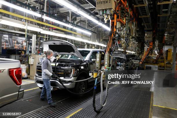 An employee works on the 40 millionth Ford Motor Co. F-Series truck on the assembly line at the Ford Dearborn Truck Plant on January 26, 2022 in...