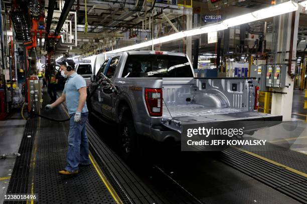 An employee works on the 40 millionth Ford Motor Co. F-Series truck on the assembly line at the Ford Dearborn Truck Plant on January 26, 2022 in...