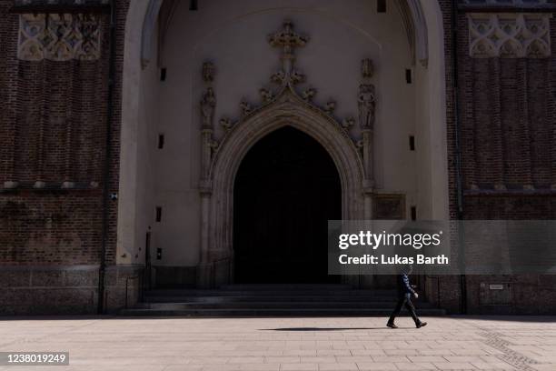 People walk in front of the Frauenkirche cathedral on January 27, 2022 in Munich, Germany. Cardinal Reinhard Marx, the Archbishop of the Roman...
