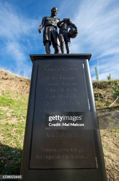 A bronze statue of Los Angeles Lakers legend Kobe Bryant and his daughter Gianna, including the names of all 9 victims on the steel pedastal, is...