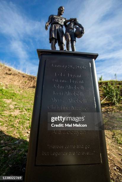 A bronze statue of Los Angeles Lakers legend Kobe Bryant and his daughter Gianna, including the names of all 9 victims on the steel pedastal, is...